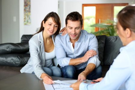 couple talking to a real estate agent